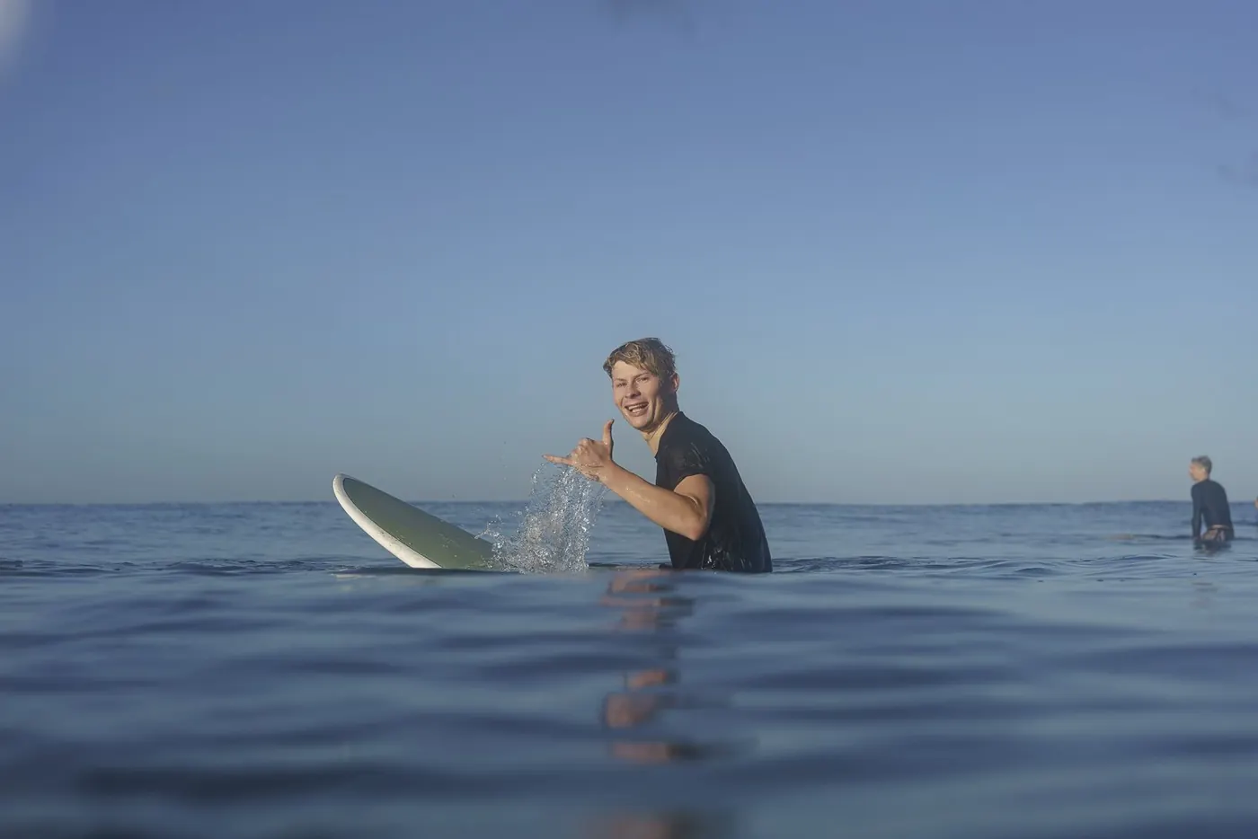 Josh Morley-Fletcher out in the water on his board